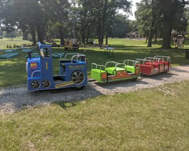 Happy kids at a party enjoying inflatables and Kids Train Ride Rental in Peoria IL