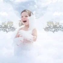 Young boy enjoying a foam party outdoors, one of the many Party Rentals for Peoria and Bloomington offered by Mike's Trackless Trains