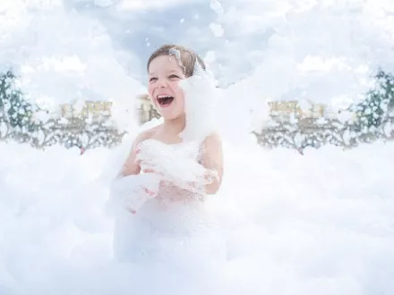 Young boy enjoying a foam party outdoors, one of the many Party Rentals for Peoria and Bloomington offered by Mike's Trackless Trains